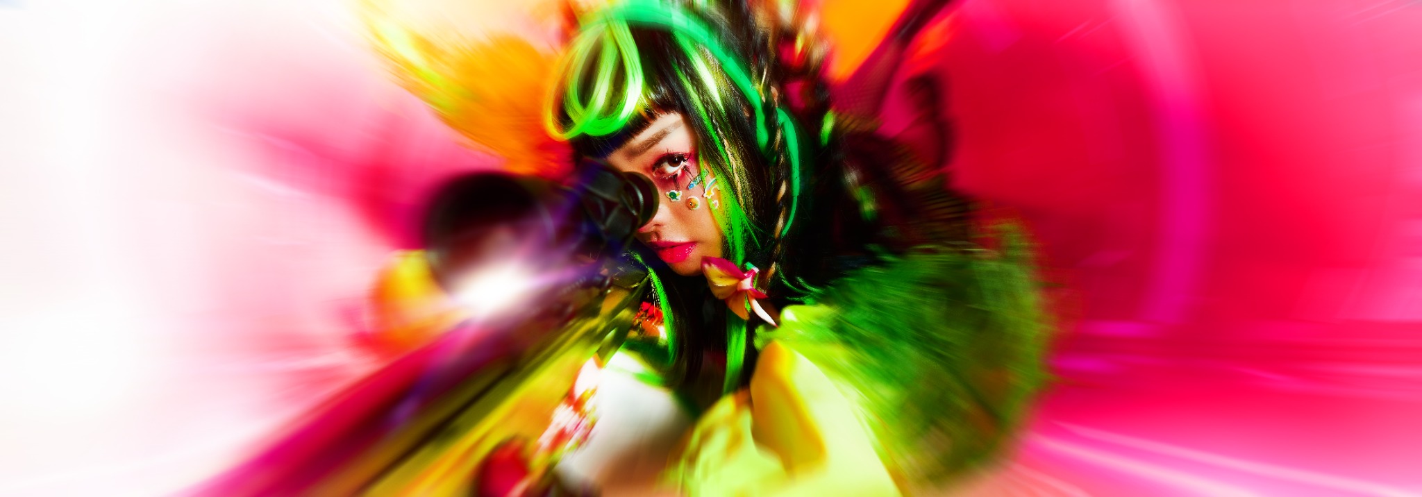 Thai dystopian pop artist Pyra in an electric pink, orange and acid-green portrait